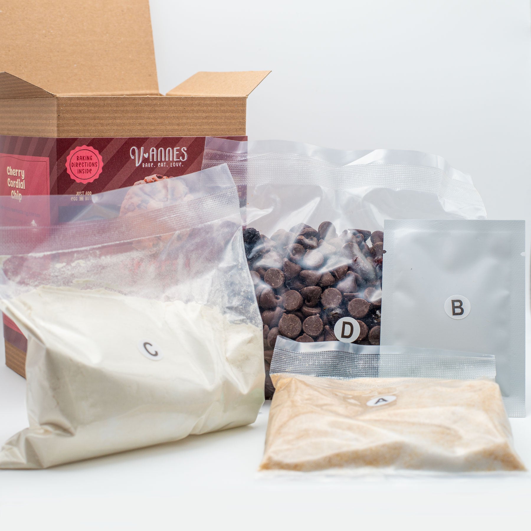 Packages of ingredients the comes in Cherry Cordial Chip cookie mix